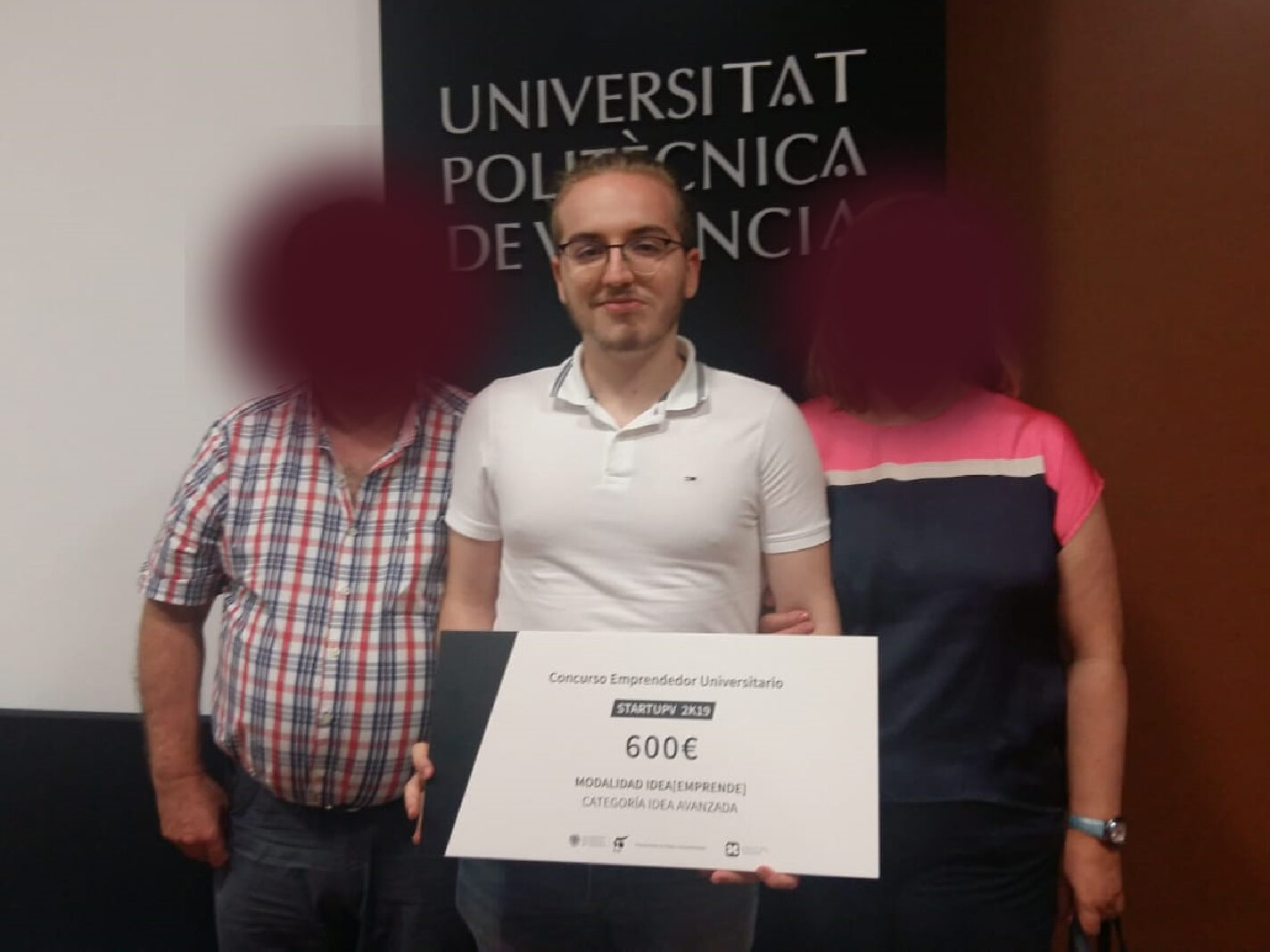 Me with my family while I hold the award